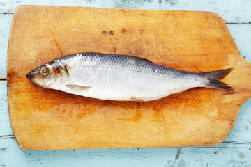 herring on a wooden board