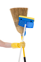 Hand holding a mop and a broom - Household chores