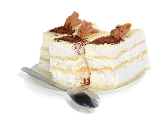 Sponge cakes on plate with cup of coffee . Isolated