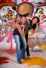 Obraz na płótnie Canvas Teen girls graffiti wall