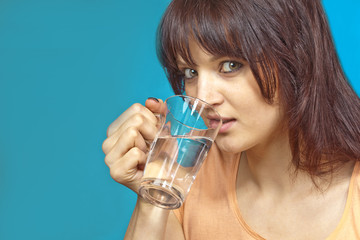 Young woman drinking a glas of water