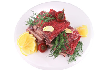 juicy ribs with lemon and greenery