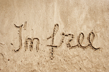 I`m free handwritten in sand for natural, symbol,tourism