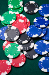 Poker chips on green felt