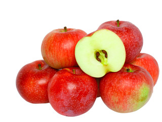Heap of ripe, red apples and cut one . Isolated on white.