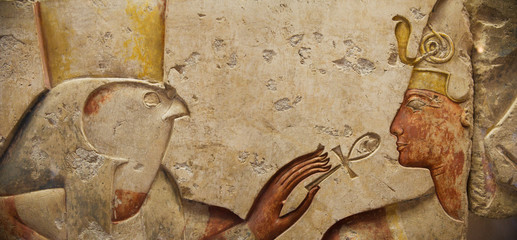 Egyptian relief: Horus and the Pharaoh - obrazy, fototapety, plakaty