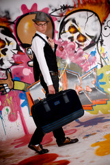 Teen suitcase graffiti wall