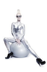 Obraz na płótnie Canvas Beautiful cyber woman sitting on a silver ball ....