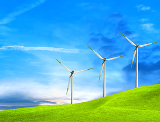 Wind turbines farm on green field