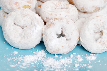 small icing sugar covered donuts - Powered by Adobe
