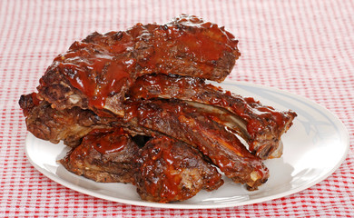 Stack of barbecue beef spare ribs with sauce