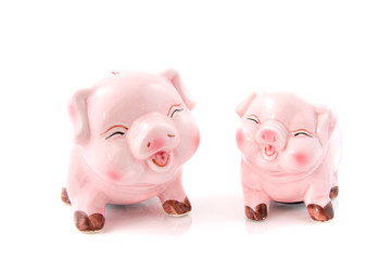 Two laughing pink piggy bank over white background