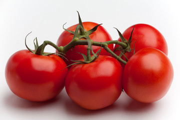 Five tomatoes on the vine