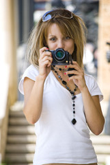 beautiful young woman with camera