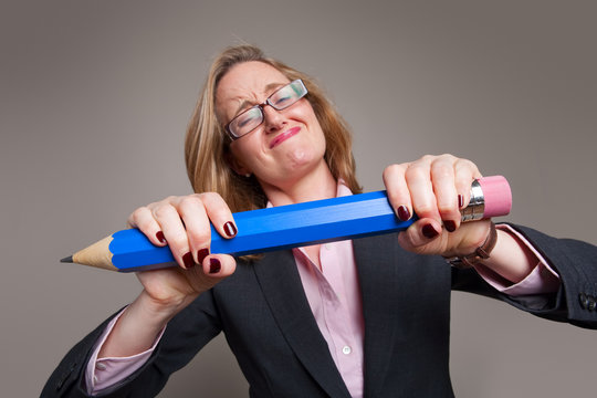 Businesswoman giant blue pencil