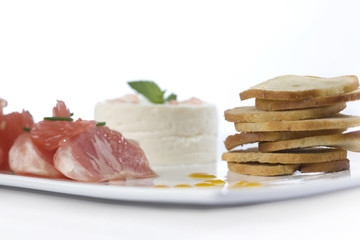 Goat cheese with grape fruit and bake rolls