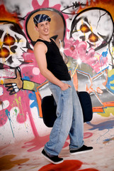 Obraz na płótnie Canvas Teen suitcase graffiti wall