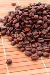 Coffee grains on brown background