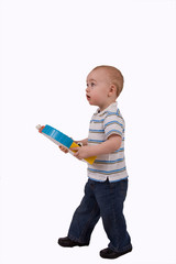 Small boy with toy standing