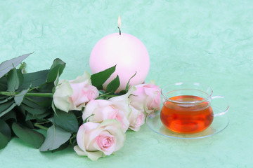 cup of tea, pink roses and candle