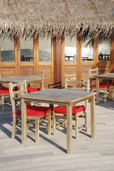 Fototapeta na wymiar Beach restaurant view in Maldives (ocean reflection)