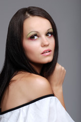 Naklejka premium european woman with pink and green eye shadow