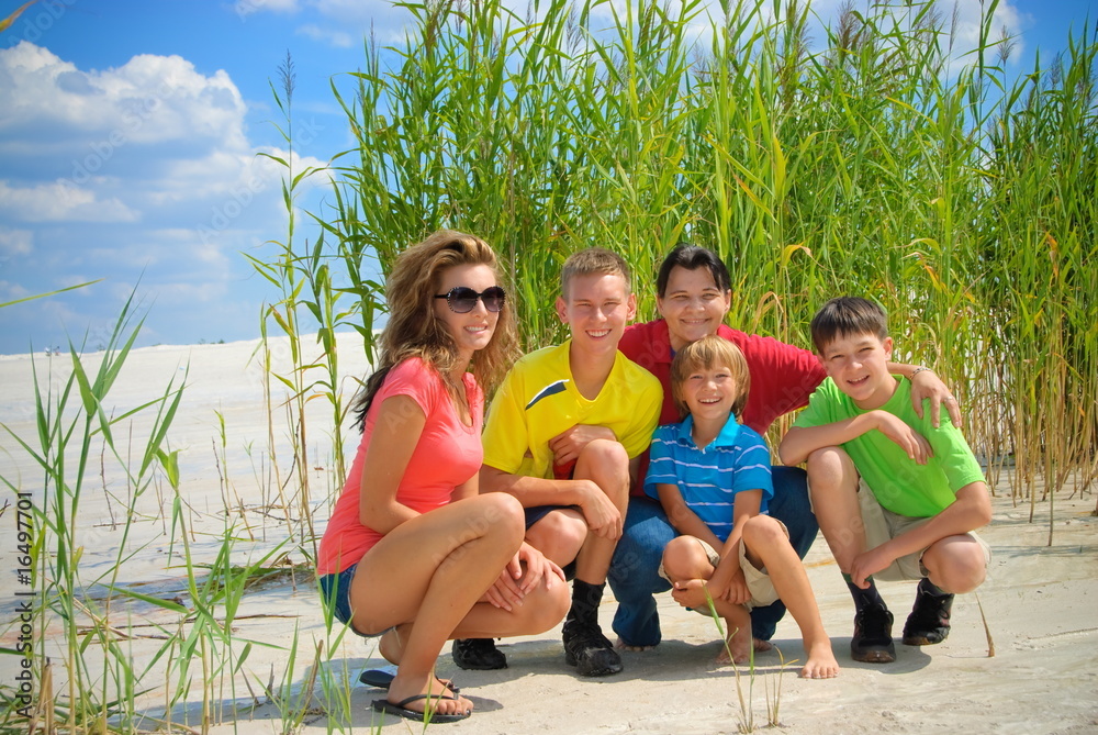 Wall mural family on shore