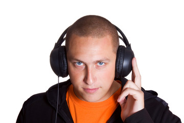 The young man listens to music