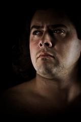 Strong and confident young man portrait looking away