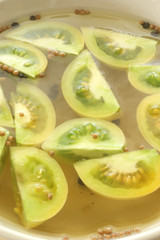 some fresh green organic tomatoes to make sour vegetable