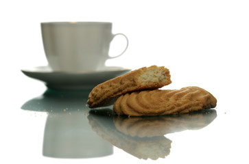 White cup of coffee and cookies on a white background
