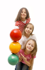 Fototapeta na wymiar Girls with colored balls imitating traffic lights