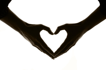 Heart on a white background made by hands