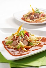 Pasta and meatballs in tomato sauce