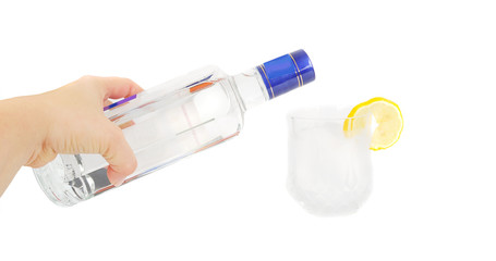 Vodka bottle in human arm and  glass.