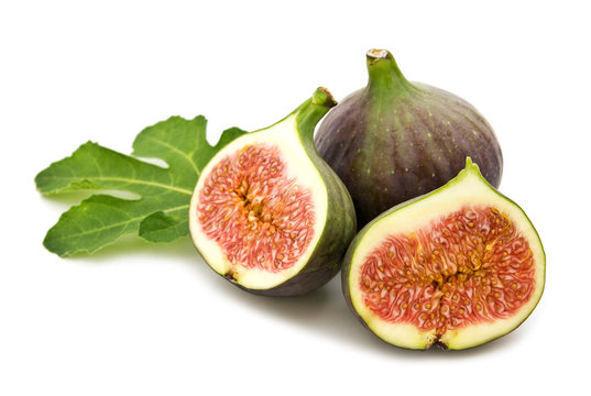 fresh figs and leaf on white background