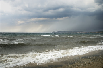 Fototapeta na wymiar Seaside in stormy weather with dark clouds
