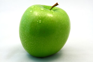 Green apple with waterdrops