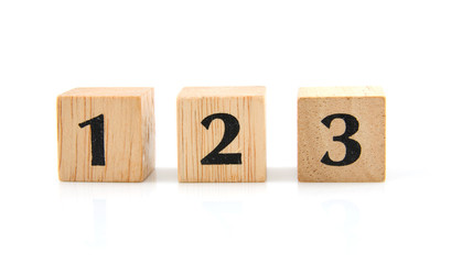 Wooden blocks with numbers over white background
