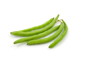 Five raw green beans isolated on white background