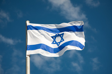 Fototapeta na wymiar Israel flag against blue sky