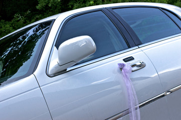 Decorated ribbon, elegant wedding car