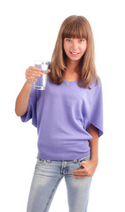 Woman holds a glass of pure water