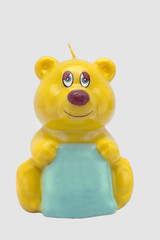 Candela-orsetto augurale su sfondo bianco