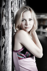 Naklejka premium Young Pretty Woman Against Grunge Wall