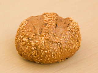 Sesame bun on the wooden background