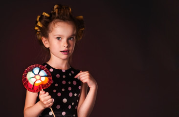 curly girl with lollipop