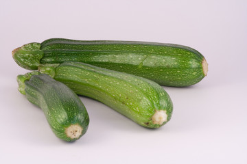 Courgettes on white.