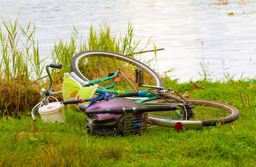 Fisherman left bike on a bank