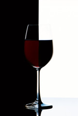 Red wine glass on a black and white background